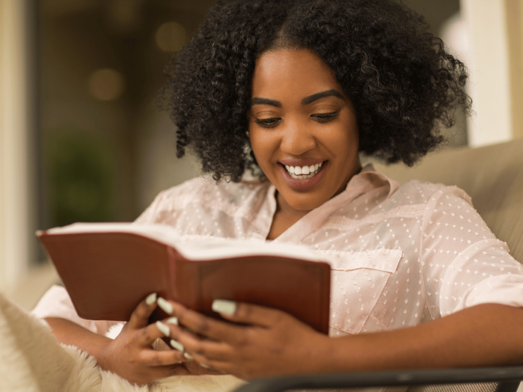 Image of a black woman reading her bible 
